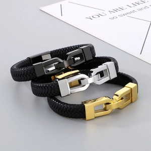 Detailed view of woven leather bracelets with U-shaped metal horseshoe clasps in three colors