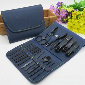 Detail view of a 16-piece black stainless steel nail clipper set in a blue faux leather case