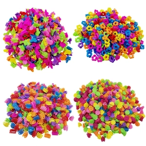 Macro view of assorted colorful mini hair clips in butterfly, flower, and star shapes