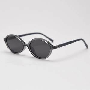 Detail view of oval retro sunglasses with grey transparent frame and dark grey lenses