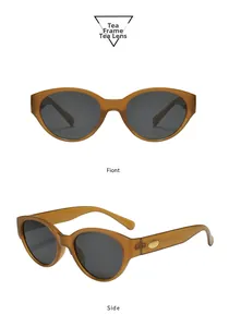Vue détaillée des lunettes de soleil œil de chat thé avec accent doré sur la branche