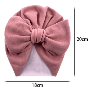 Pink cashmere-like baby turban hat with oversized bow and 18cm x 20cm size markings
