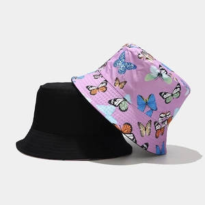 Women's cotton bucket hat featuring colorful butterfly patterns and reversible black design
