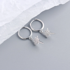 Close-up of S925 sterling silver star drop earrings with sparkling cubic zirconia crystals