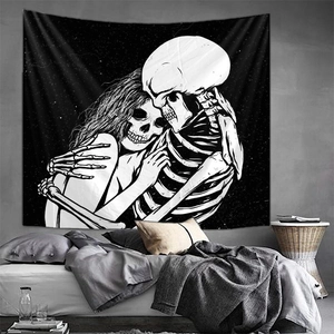 Detail of black and white skull tapestry hanging in a modern bedroom interior