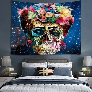 Detailed view of sugar skull tapestry with floral design on a dark starry bedroom wall