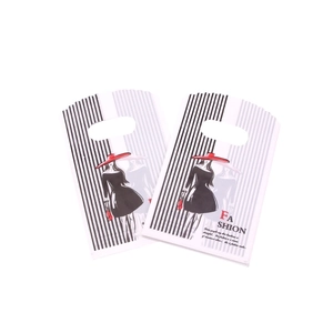 Detail of white 9x15cm plastic gift bag with black stripes and Fashion typography