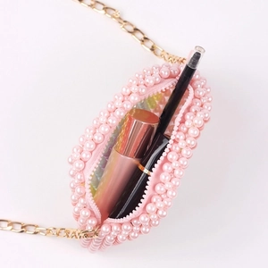Mini pink pearl beaded crossbody bag with gold chain and colorful rainbow accents