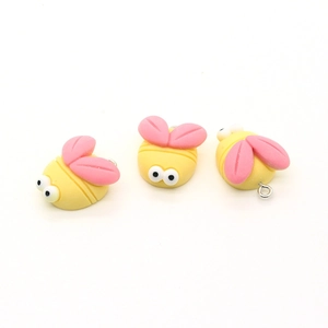 Three cute resin bee pendants with pink wings and yellow bodies for DIY crafts