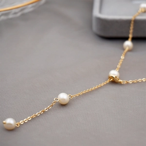Adjustable golden chain necklace with lustrous white freshwater pearls for women