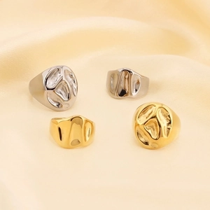 Modern lava-style liquid metal rings in gold and silver finish with organic textures