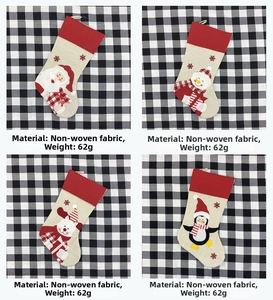 Detail view of large Christmas stockings with reindeer and santa felt embroidery patterns