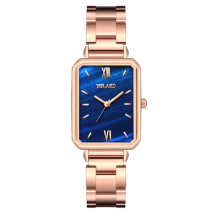 Elegant rose gold rectangular watch with a dark blue marble dial for women