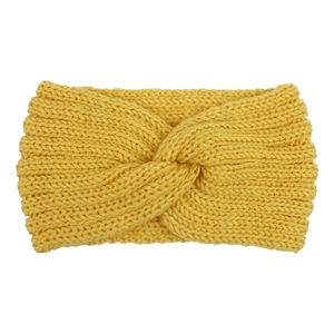 Detail of yellow knitted headband featuring a cross-twist knot and textured wool fabric