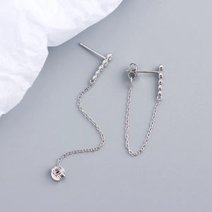 Close-up of S925 sterling silver drop earrings with long chain tassels and small diamonds