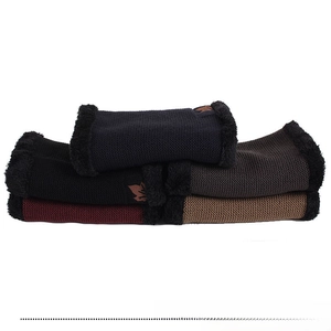 Close-up of winter knit neck warmer gaiters with thick plush lining and maple leaf patch