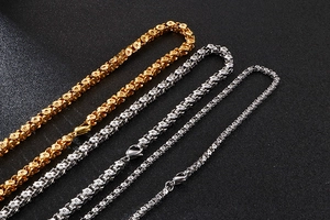 Macro shot of 304 stainless steel chain necklaces in gold, silver and black finishes