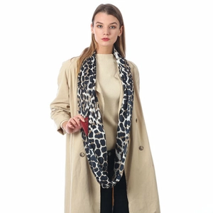 Leopard print infinity scarf for women styled with a beige trench coat for autumn fashion