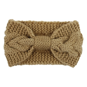 Detailed knit texture of a camel cable-knit headband with a central bow knot design