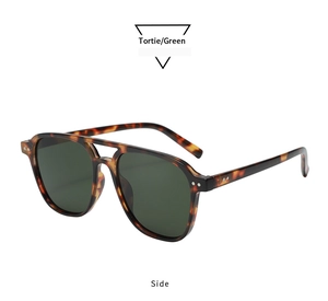 Detailed side view of vintage tortoiseshell square frame sunglasses with green lenses