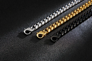 Detailed macro of chunky weave snake bone chains with lobster clasps in silver gold and black