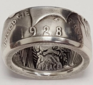 Macro shot of vintage 1928 coin ring with Peace and In God We Trust engravings