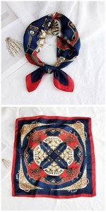 Detail of square silk scarf with navy red classic chain patterns and tassel prints