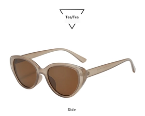 Side view of retro oval cat-eye sunglasses with translucent tea frames and dark brown lenses