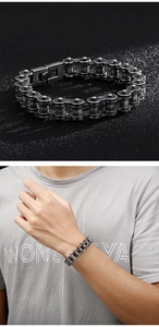 Close-up of retro silver industrial bicycle chain bracelet with secure fold-over clasp