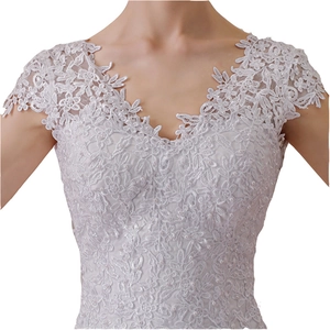 Elegant white mermaid bridal gown with floral lace embroidery and pearl beads