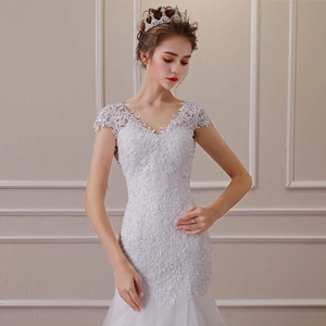 Elegant white lace mermaid wedding dress with V-neckline and floral embroidery
