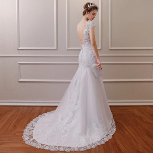 Elegant white mermaid wedding dress with lace lace train and backless detail for brides