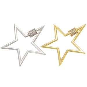 Close-up of star-shaped spring clasps in gold and silver with micro-pave crystals