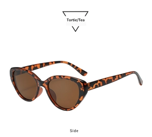 Side view of retro oval cat-eye sunglasses with tortie frames and tea lenses