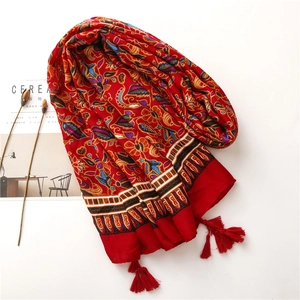 Red Bohemian floral scarf with ethnic prints and red tassels on white background
