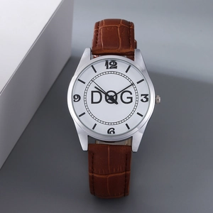 Close-up of classic silver metal watch with brown leather strap and D&G dial logo