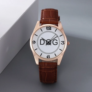 Macro shot of rose gold watch case with brown leather strap and white dial