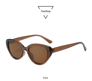 Side view of retro oval cat eye sunglasses with tea brown translucent frames and lenses