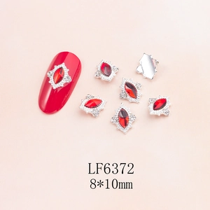 Macro detail of red marquise nail rhinestone charm in 8x10mm alloy vintage frame