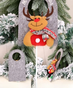 Detail view of felt Christmas reindeer door hanging with Feliz Navidad greeting