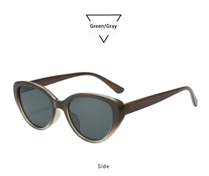 Side view of retro oval cat-eye sunglasses with gradient green frame and gray lenses