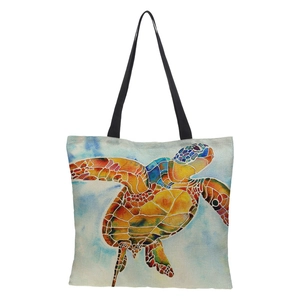 Detail showing vivid watercolor sea turtle print on durable cream linen tote bag