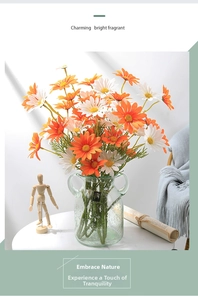 Artificial daisy bouquet in bubble glass vase with handles for home decor