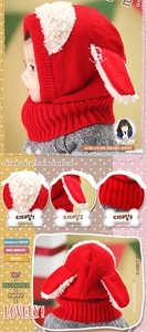 Detail of red knit baby winter hat with plush dog ears and integrated warm neck scarf