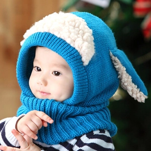Detail of blue knitted baby hooded scarf with soft white fleece lining and ear protection