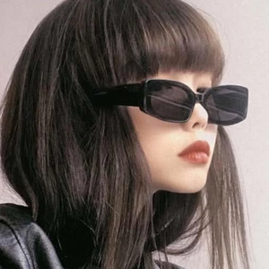 Side view of retro black rectangle sunglasses with Y2K hip hop style on model