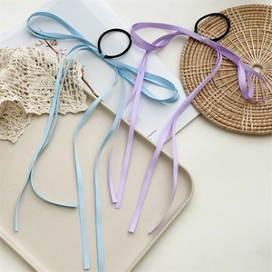 Elastic bow ponytail holder with long ribbon streamers in light blue and lavender