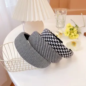 Classic houndstooth padded headband set in black and white fabric for women