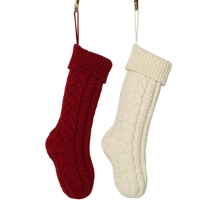 Classic 18-inch knitted Christmas stockings in red and cream white with cable knit patterns