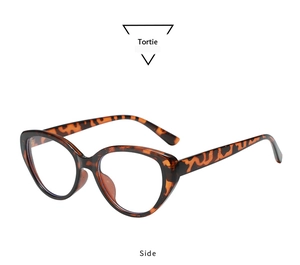 Detail view of vintage tortie cat eye sunglasses with amber textured frames from a side angle